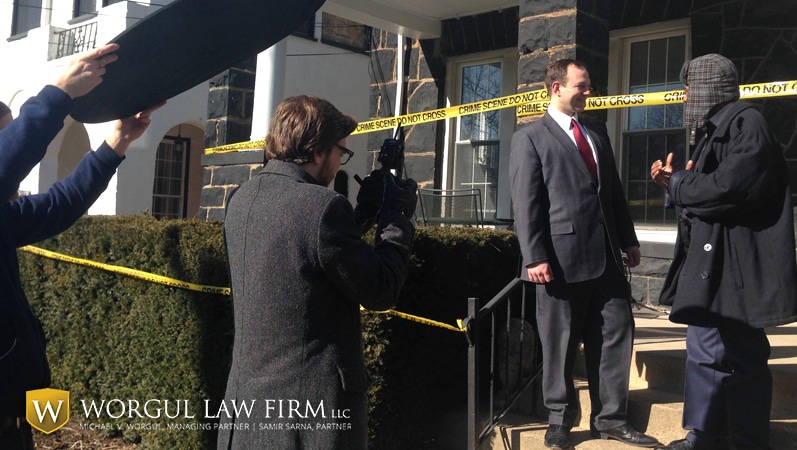 Worgul Law Firm behind the scenes with cameraman photographing crime scene